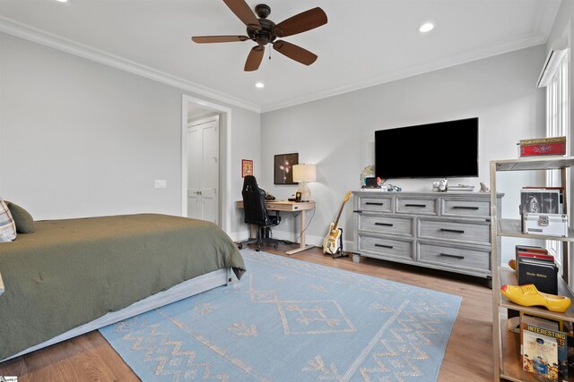 bedroom featuring crown molding, ceiling fan, and light hardwood / wood-style flooring