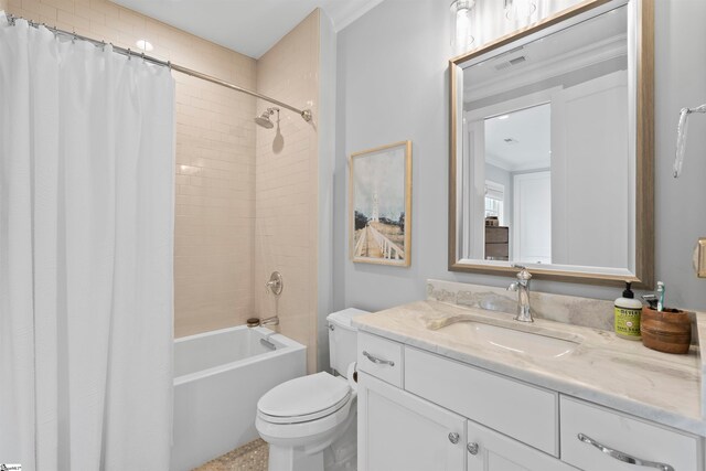 full bathroom featuring ornamental molding, vanity, toilet, and shower / bathtub combination with curtain