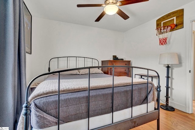 bedroom featuring hardwood / wood-style floors and ceiling fan