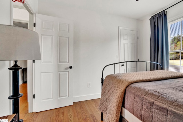 bedroom with hardwood / wood-style floors