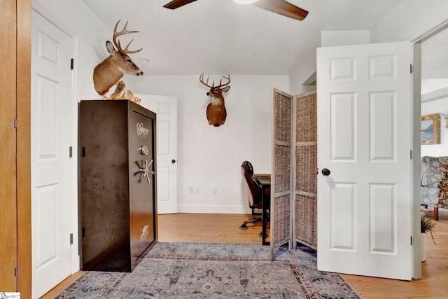 office space featuring light hardwood / wood-style floors and ceiling fan