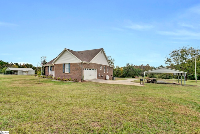 view of home's exterior with a yard, a garage, and a carport