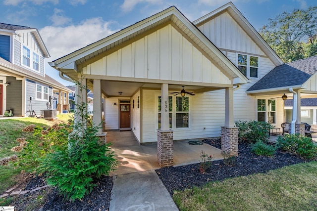 craftsman-style house featuring central AC unit and ceiling fan