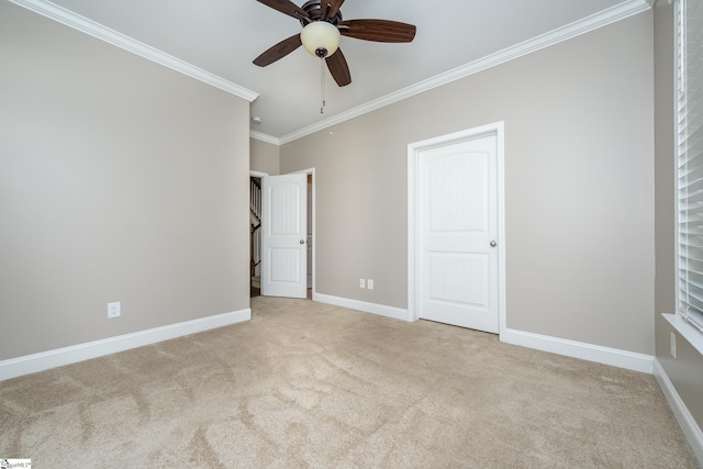 unfurnished bedroom with light carpet, ornamental molding, and ceiling fan