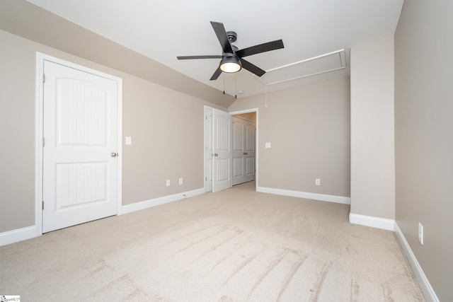 unfurnished bedroom with light colored carpet and ceiling fan