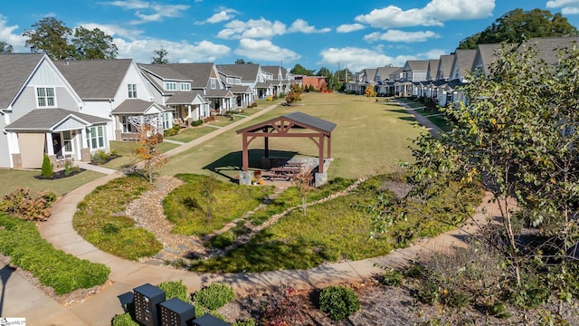 surrounding community featuring a gazebo and a yard