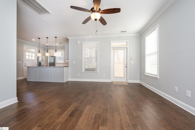 unfurnished living room featuring ornamental molding, dark wood-type flooring, and ceiling fan