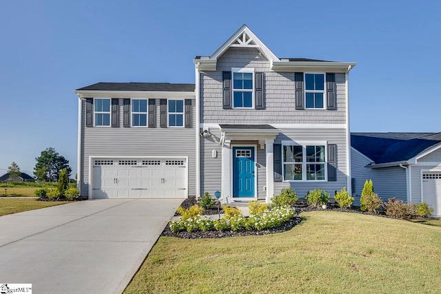 view of front of house featuring a front lawn and a garage