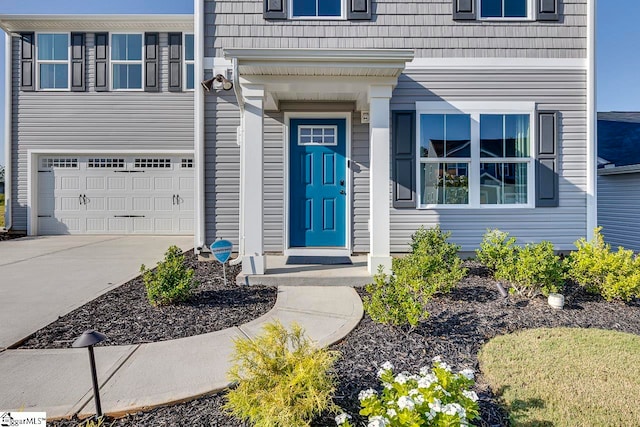 view of exterior entry featuring a garage