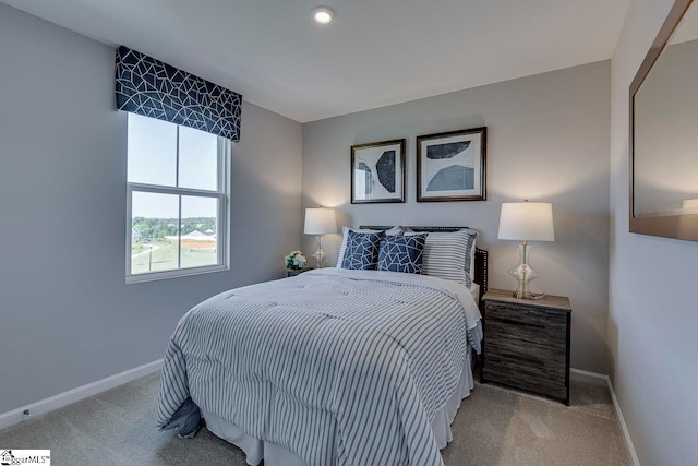 bedroom featuring light colored carpet