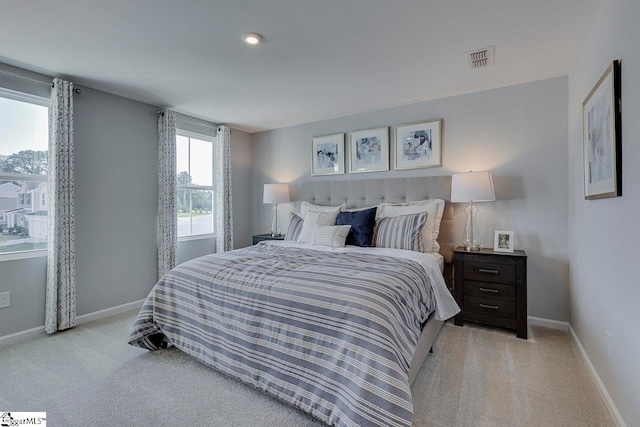 bedroom with light carpet