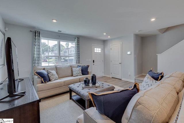 living room with light hardwood / wood-style flooring