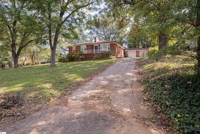 single story home with a front lawn and a garage