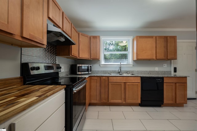 kitchen with decorative backsplash, stainless steel appliances, wood counters, sink, and crown molding