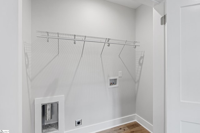 washroom featuring hardwood / wood-style floors, hookup for a washing machine, and electric dryer hookup