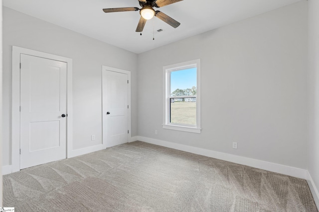 unfurnished bedroom with carpet flooring and ceiling fan