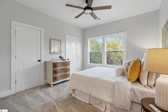 carpeted bedroom with ceiling fan