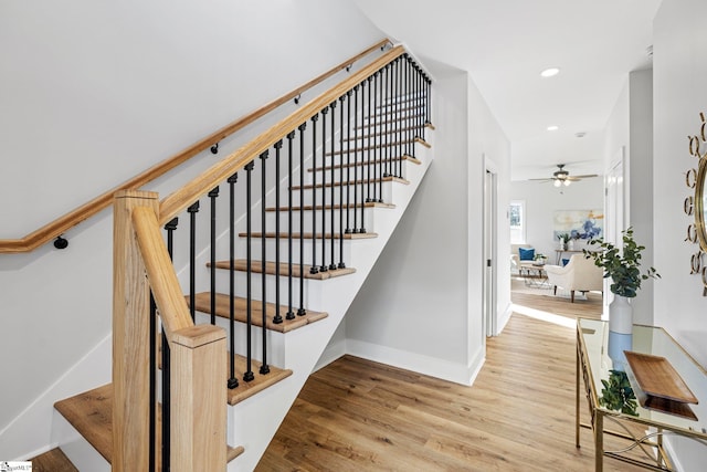 staircase featuring wood-type flooring