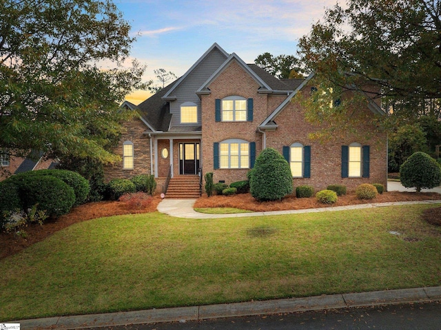 view of front of house with a lawn