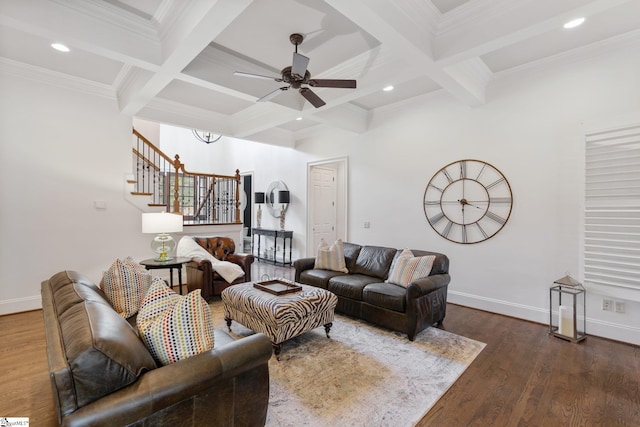 living room with beamed ceiling, coffered ceiling, and dark hardwood / wood-style flooring