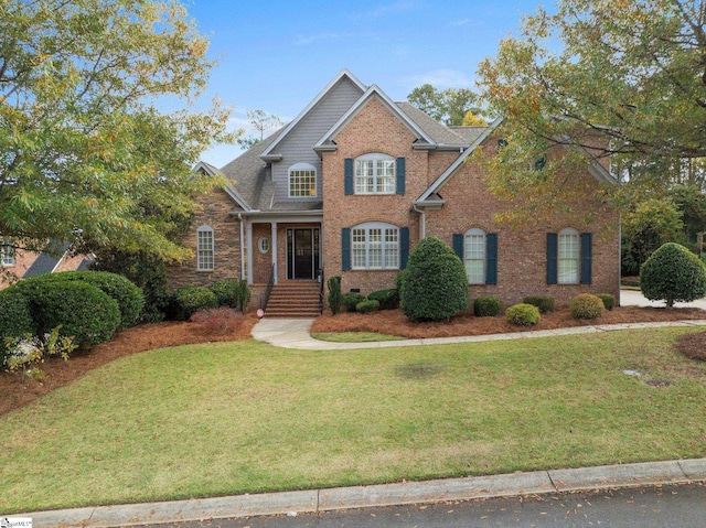 view of front of home featuring a front yard