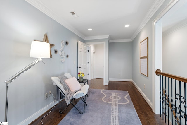 living area with crown molding and dark hardwood / wood-style flooring