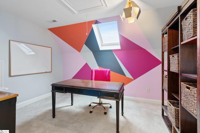 home office with vaulted ceiling and light colored carpet