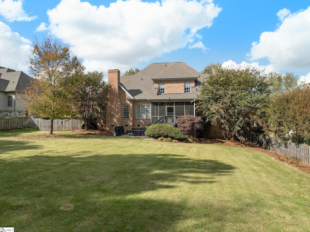 view of yard featuring a sunroom