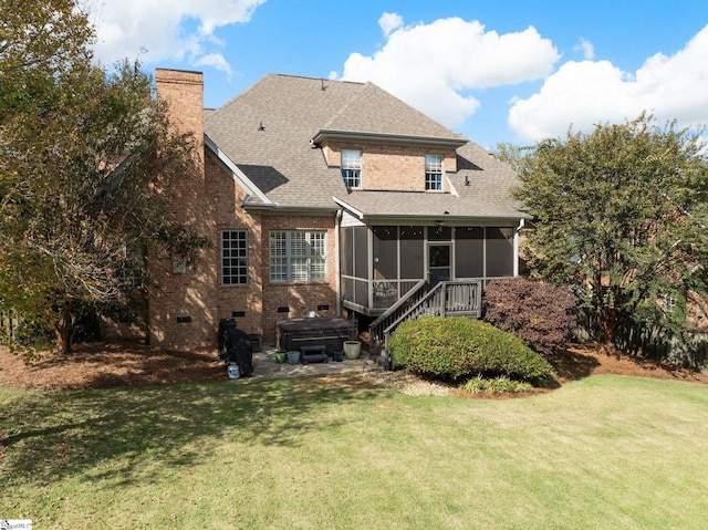 back of property featuring a yard and a sunroom