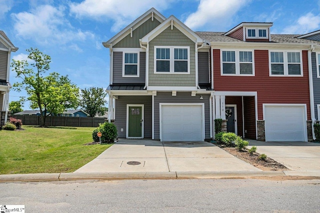 view of front of property featuring a front yard and a garage