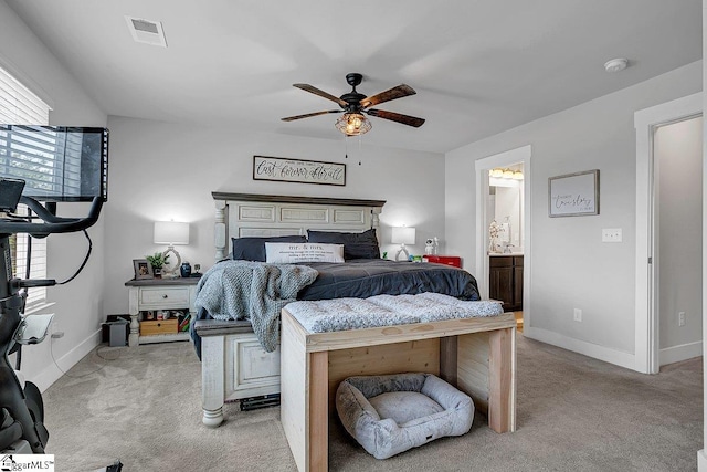 carpeted bedroom featuring connected bathroom and ceiling fan