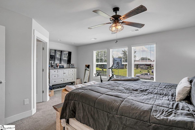 bedroom featuring ceiling fan and light colored carpet