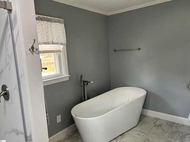 bathroom with ornamental molding and a bath