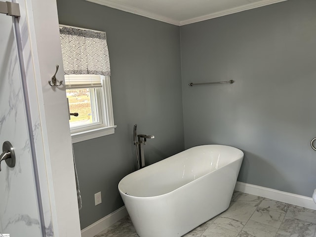 611 Shands St, Clinton, SC 29325 - bathroom with marble look tile flooring, a freestanding bath, and ornamental molding