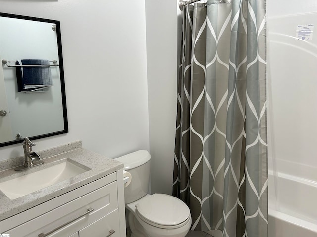 full bathroom featuring vanity, toilet, and shower / bathtub combination with curtain