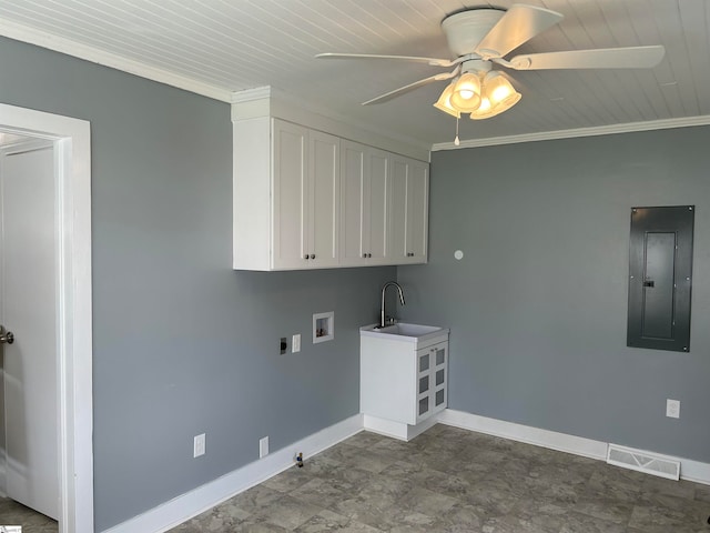 clothes washing area featuring ornamental molding, cabinets, electric dryer hookup, washer hookup, and electric panel