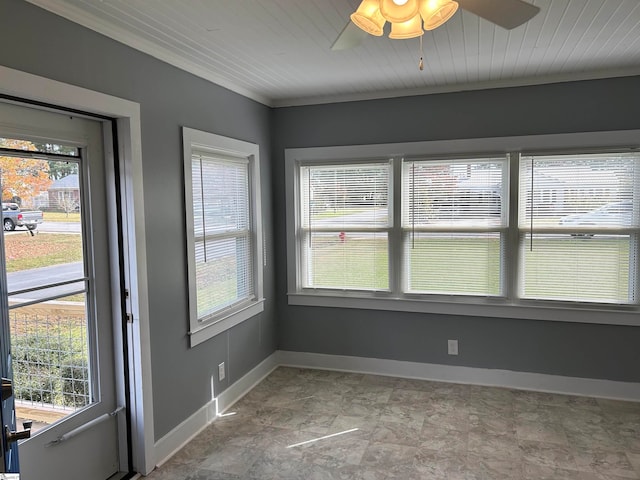 unfurnished sunroom with ceiling fan and wood ceiling