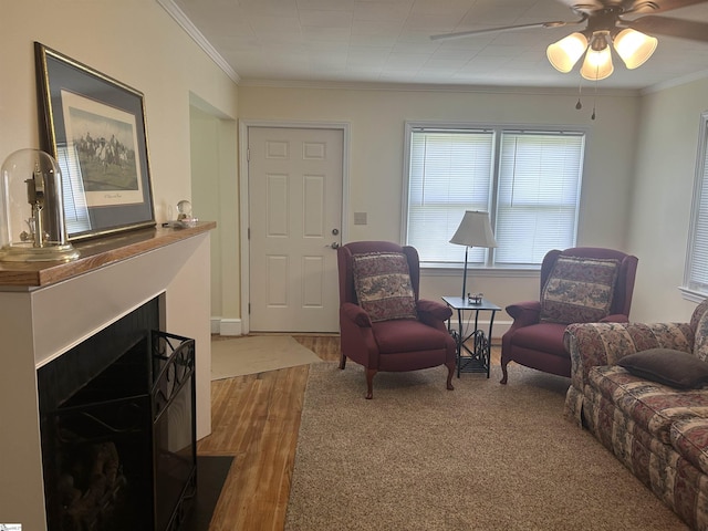 611 Shands St, Clinton, SC 29325 - living area with wood finished floors, crown molding, ceiling fan, and a fireplace