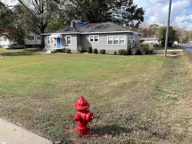 611 Shands St, Clinton, SC 29325 - view of front of home featuring a front yard and a chimney