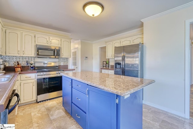 kitchen featuring a kitchen island, cream cabinetry, backsplash, ornamental molding, and appliances with stainless steel finishes