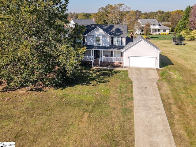 view of front of home with a front yard, a porch, and a trampoline