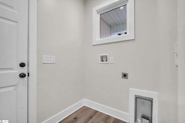 laundry area featuring laundry area, wood finished floors, baseboards, hookup for a washing machine, and hookup for an electric dryer