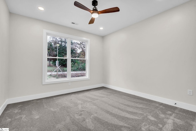 unfurnished room featuring carpet floors, baseboards, and visible vents