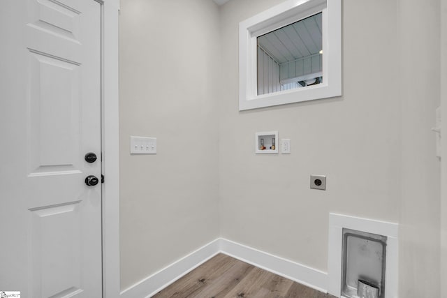 washroom with laundry area, wood finished floors, baseboards, electric dryer hookup, and washer hookup