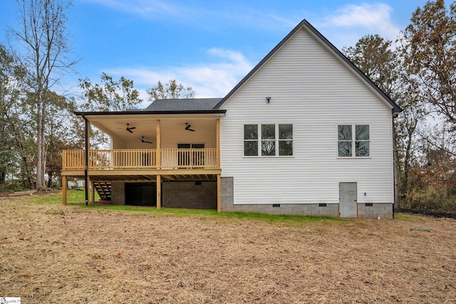 rear view of house featuring ceiling fan, a deck, a shingled roof, crawl space, and stairway