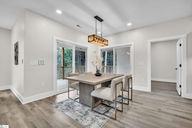 dining space featuring recessed lighting, baseboards, light wood-type flooring, and visible vents
