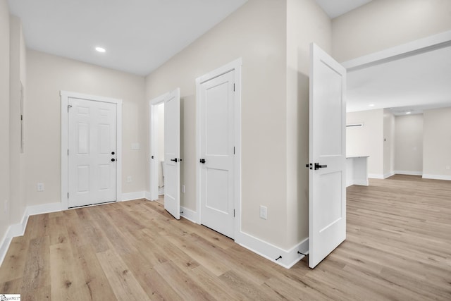 hall with light hardwood / wood-style flooring