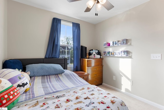 bedroom with light carpet and ceiling fan