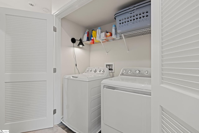 washroom featuring washer and dryer