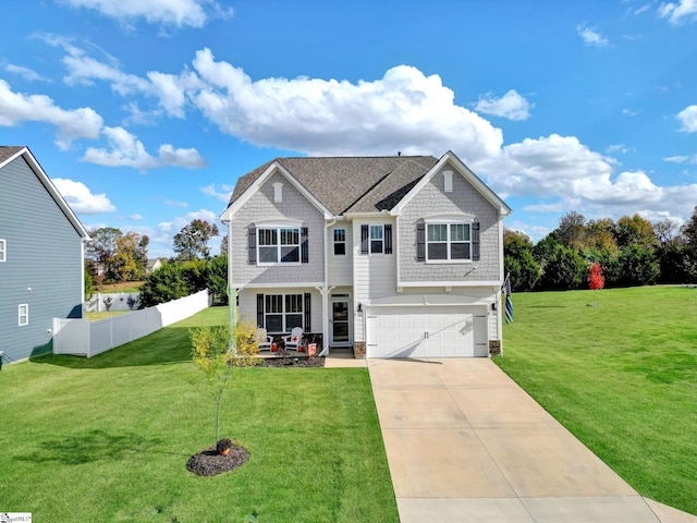 view of front facade featuring a front yard and a garage